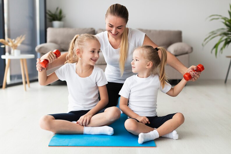 [fpdl.in]_front-view-of-mother-and-daughters-exercising-at-home_23-2148492529_medium (1).jpg